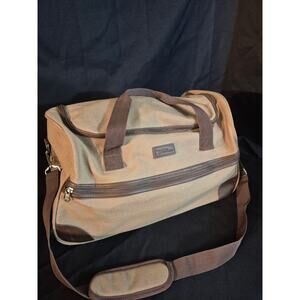 Bella Russo Brown Canvas Soft Duffel Bag with Wheels And A Pull Out handle .